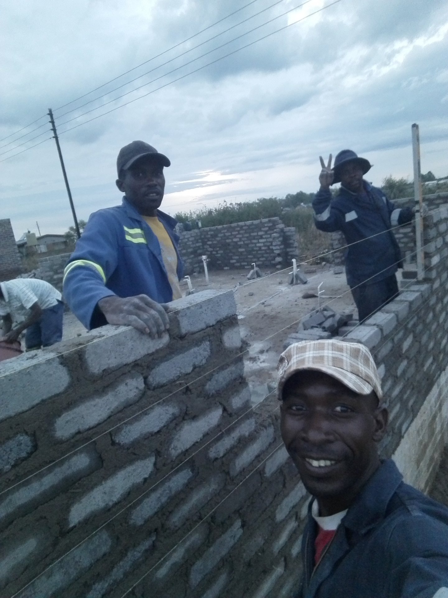 Fabish builders laying block walls on a new build